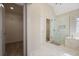 Bathroom with marble floors, a glass shower, a garden tub, and access to a walk-in closet at 366 Greycoat Sw Blf, Marietta, GA 30064