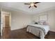 Cozy bedroom with tray ceiling, hardwood floors, and neutral tones at 366 Greycoat Sw Blf, Marietta, GA 30064