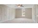 Bright bedroom featuring neutral walls, carpet, and a large arched window at 366 Greycoat Sw Blf, Marietta, GA 30064