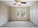 Bedroom with soft carpet, ceiling fan, natural light, and large closet at 366 Greycoat Sw Blf, Marietta, GA 30064