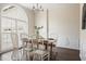 Elegant dining room featuring hardwood floors, a large window, and wainscoting details at 366 Greycoat Sw Blf, Marietta, GA 30064