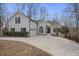 Charming white brick home with black shutters and arched windows on a tree-lined lot at 366 Greycoat Sw Blf, Marietta, GA 30064