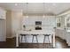Bright eat-in kitchen featuring white cabinets, stainless steel appliances, and a large center island with bar seating at 366 Greycoat Sw Blf, Marietta, GA 30064