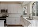 Bright eat-in kitchen featuring white cabinets, stainless steel appliances, and views of the backyard at 366 Greycoat Sw Blf, Marietta, GA 30064