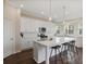 Bright eat-in kitchen featuring white cabinets, stainless steel appliances, and a large center island with bar seating at 366 Greycoat Sw Blf, Marietta, GA 30064