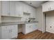 Kitchen area featuring white cabinets, granite countertops, and wood flooring at 366 Greycoat Sw Blf, Marietta, GA 30064