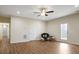 Open living room with hardwood floors, ceiling fan, and a backyard view at 366 Greycoat Sw Blf, Marietta, GA 30064