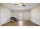Open living room with hardwood floors, ceiling fan, and a backyard view at 366 Greycoat Sw Blf, Marietta, GA 30064