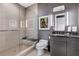 Contemporary bathroom with walk-in shower and gray vanity at 1065 Peachtree Ne St # 3102, Atlanta, GA 30309