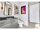 Elegant bathroom with gray vanity and modern mirror at 1065 Peachtree Ne St # 3102, Atlanta, GA 30309
