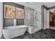 Bathroom with a large soaking tub and marble shower at 1065 Peachtree Ne St # 3102, Atlanta, GA 30309