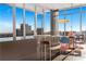Bright dining area with city views and glass partition at 1065 Peachtree Ne St # 3102, Atlanta, GA 30309
