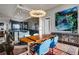 Modern dining room with wood table and blue chairs at 1065 Peachtree Ne St # 3102, Atlanta, GA 30309