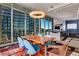 Bright dining area with city views and modern chandelier at 1065 Peachtree Ne St # 3102, Atlanta, GA 30309