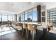 Bright kitchen features large island with seating and amazing city views through the floor-to-ceiling windows at 1065 Peachtree Ne St # 3102, Atlanta, GA 30309