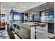 Modern kitchen with glass-front island and stainless steel appliances at 1065 Peachtree Ne St # 3102, Atlanta, GA 30309