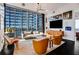 Bright living room boasts floor to ceiling windows and modern furniture in a high-rise building at 1065 Peachtree Ne St # 3102, Atlanta, GA 30309