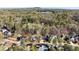 Aerial view of neighborhood surrounded by trees and a mountain in the distance at 3300 Greencastle Chase Ne, Marietta, GA 30062