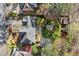Aerial view of a house with a well-maintained backyard, landscaping, and mature trees at 3300 Greencastle Chase Ne, Marietta, GA 30062