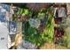 Aerial view of a house with a beautiful backyard, lush green lawn, and mature trees at 3300 Greencastle Chase Ne, Marietta, GA 30062