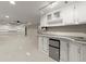 Basement bar area with a mini fridge, cabinets, lighting, and open space at 3300 Greencastle Chase Ne, Marietta, GA 30062