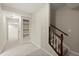 Basement hallway with carpet flooring, staircase, recessed lights, and an arched doorway at 3300 Greencastle Chase Ne, Marietta, GA 30062