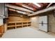 Basement workshop with carpet flooring, fluorescent lighting, pegboard and work bench at 3300 Greencastle Chase Ne, Marietta, GA 30062
