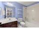 Bathroom featuring vanity, tub, and tiled shower with shelves and access to a carpeted bedroom at 3300 Greencastle Chase Ne, Marietta, GA 30062