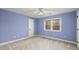 Cozy bedroom featuring light blue walls, carpeted floor, ceiling fan and a double window at 3300 Greencastle Chase Ne, Marietta, GA 30062