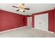 Bedroom with a large closet, carpeted flooring, and red painted walls at 3300 Greencastle Chase Ne, Marietta, GA 30062