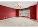 Bedroom with a beautiful bay window, carpeted flooring, and red painted walls at 3300 Greencastle Chase Ne, Marietta, GA 30062