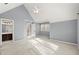 Bedroom with light-blue walls, carpeted floor, vaulted ceiling and window access to a bathroom at 3300 Greencastle Chase Ne, Marietta, GA 30062