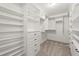 Spacious walk-in closet featuring white shelving, drawers, and ample storage space at 3300 Greencastle Chase Ne, Marietta, GA 30062