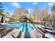 Large community pool with plenty of lounge chairs, with some trees for shade at 3300 Greencastle Chase Ne, Marietta, GA 30062
