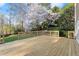 New wooden deck overlooking a lush backyard with trees at 3300 Greencastle Chase Ne, Marietta, GA 30062