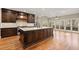 Gourmet kitchen features a large island, custom cabinetry, and an adjacent breakfast area with a beautiful view at 3300 Greencastle Chase Ne, Marietta, GA 30062