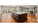 This bright kitchen features a large island with seating, stainless steel appliances, and a stunning backyard view at 3300 Greencastle Chase Ne, Marietta, GA 30062