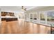 Spacious living area featuring hardwood floors, access to the deck, and a view of the kitchen at 3300 Greencastle Chase Ne, Marietta, GA 30062