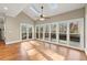 Bright sunroom with large windows and skylights that look out to a deck surrounded by a lush treed back yard at 3300 Greencastle Chase Ne, Marietta, GA 30062