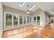 Bright sunroom with large windows and skylights that look out to a deck surrounded by a lush treed back yard at 3300 Greencastle Chase Ne, Marietta, GA 30062