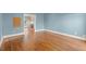 Cozy living room with hardwood flooring and access to the outdoor living spaces at 3300 Greencastle Chase Ne, Marietta, GA 30062