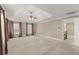Spacious main bedroom with recessed ceiling, ceiling fan, and several windows bringing in natural light at 3300 Greencastle Chase Ne, Marietta, GA 30062