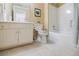 Clean bathroom with white vanity, toilet, and bathtub at 770 Westwind Ln, Alpharetta, GA 30005