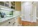 Butlers pantry with granite countertop and glass-front cabinetry at 770 Westwind Ln, Alpharetta, GA 30005