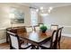 Formal dining room with hardwood floors, chandelier, and large table at 770 Westwind Ln, Alpharetta, GA 30005