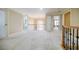 Hallway with an arched window and views of the home's layout at 770 Westwind Ln, Alpharetta, GA 30005