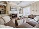 Cozy living room featuring a brick fireplace and built-in shelving at 770 Westwind Ln, Alpharetta, GA 30005