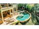 Luxury kidney shaped pool with fountain and patio at 770 Westwind Ln, Alpharetta, GA 30005