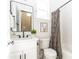 Small bathroom with white vanity, black matte fixtures and patterned shower curtain at 185 Marion # B, Atlanta, GA 30307