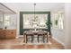 Bright dining room with a green accent wall and wood floors at 185 Marion # B, Atlanta, GA 30307